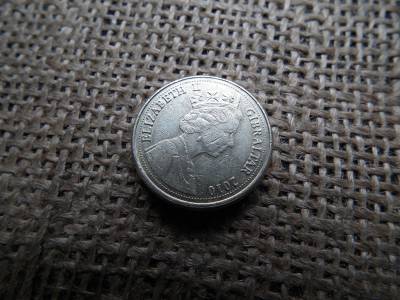 1 pound 2010 Gibraltár , II. Erzsébet neandervölgyi koponyája 1 pound 2010 Gibraltár , II. Erzsébet neandervölgyi koponyája